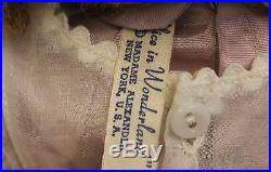 17 Madame Alexander Alice In Wonderland tagged hard plastic Maggie Face c. 1949