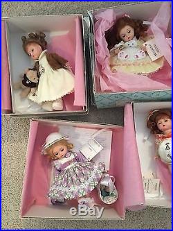 Lot of 9 Madame Alexander 8 inch dolls with original boxes and accessories