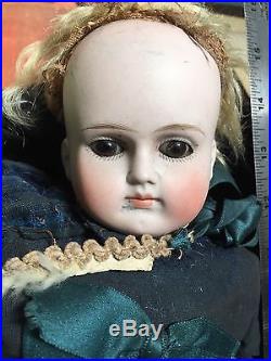 Vintage Doll in poor condition looks like sawdust for stuffing look at pics