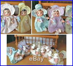 Vintage composition Dionne Quintuplets dolls with crib and nurse, 1930's
